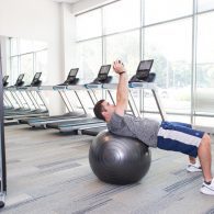 A man is doing an exercise on a ball.